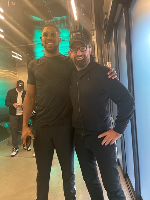 Terry Fisher arm in arm with boxer Anthony Joshua