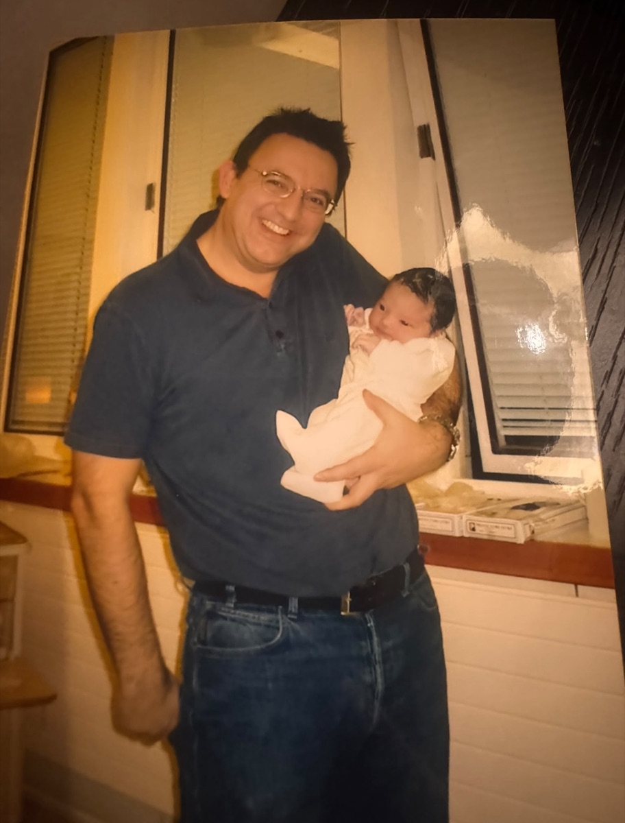 Terry Fisher holding Harry as a baby