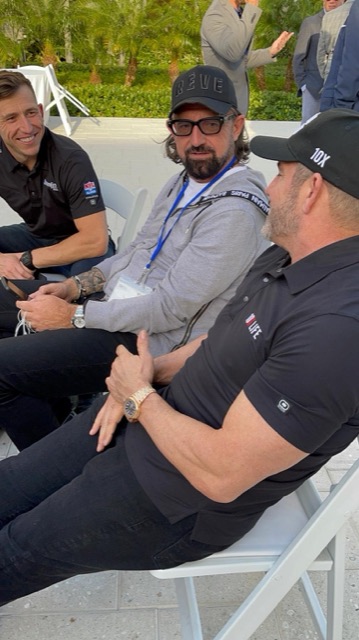 Terry Fisher seated between Grant Cardone and another attendee at 10X